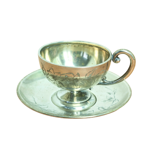 Taza y plato en plata 800 con decoración floral grabada